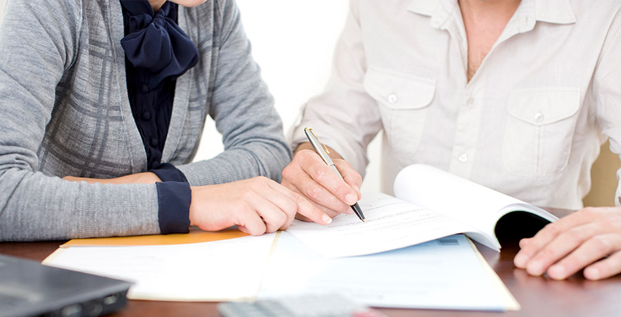 people looking over documents